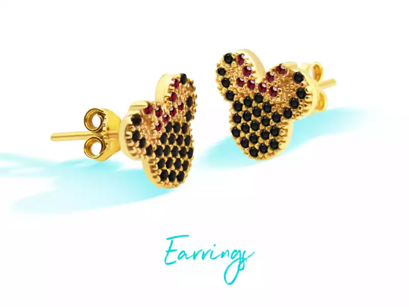Gold children's earrings with cartoon design and black and red gems